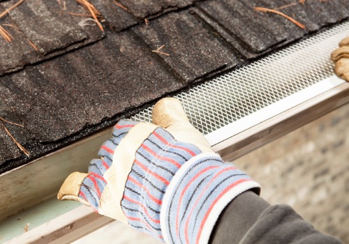 Man installing new Gutter Guards in Pekin IL