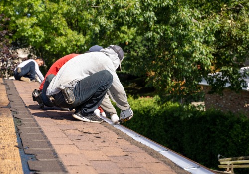 Team repairing gutters after completing Gutter Cleaning in East Peoria IL