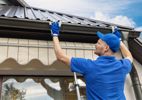 A man installing new gutters in Dunlap IL